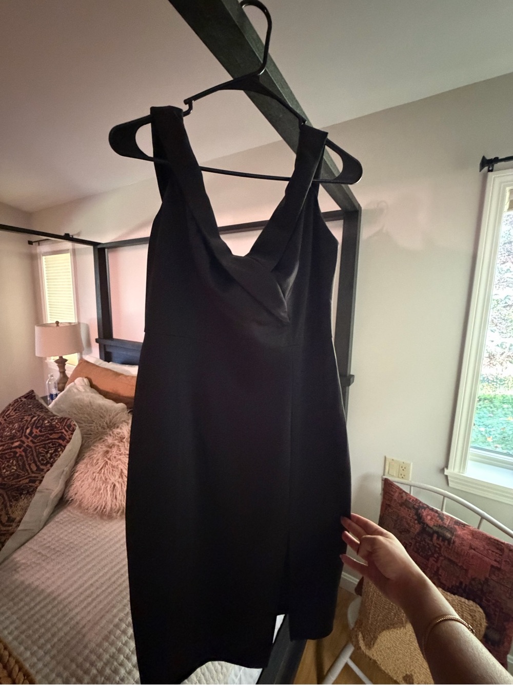 Sleek Black Mini Dress with Draped V-Neck